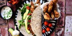 Chicken goujon wrap with roast tomatoes, fresh avocado and parmesan & garlic mayo